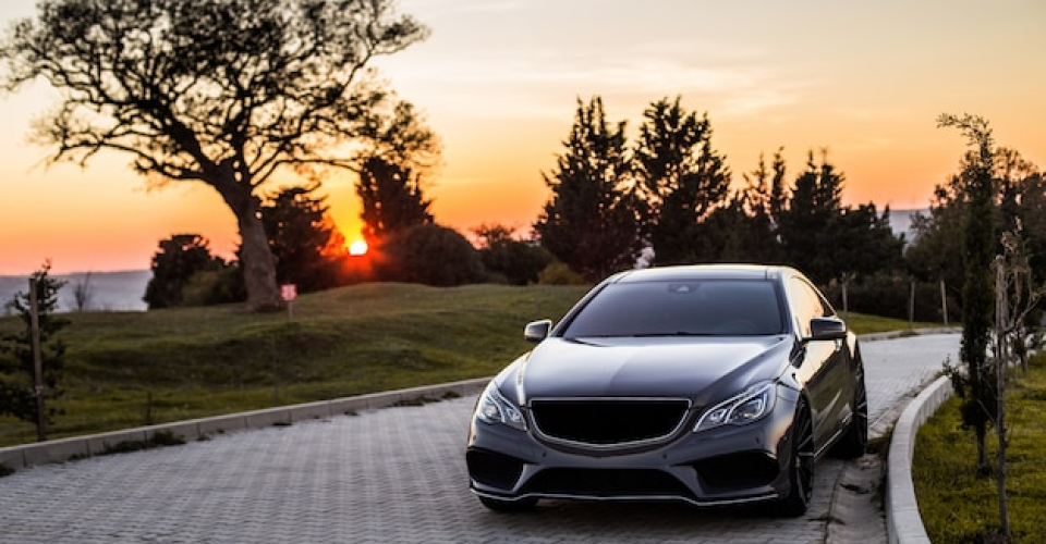 grey-luxury-sedan-car-sunset_114579-4045